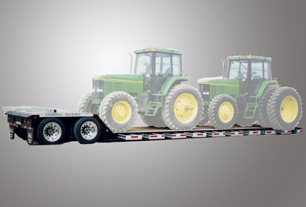 Two tractors on a Landoll trailer