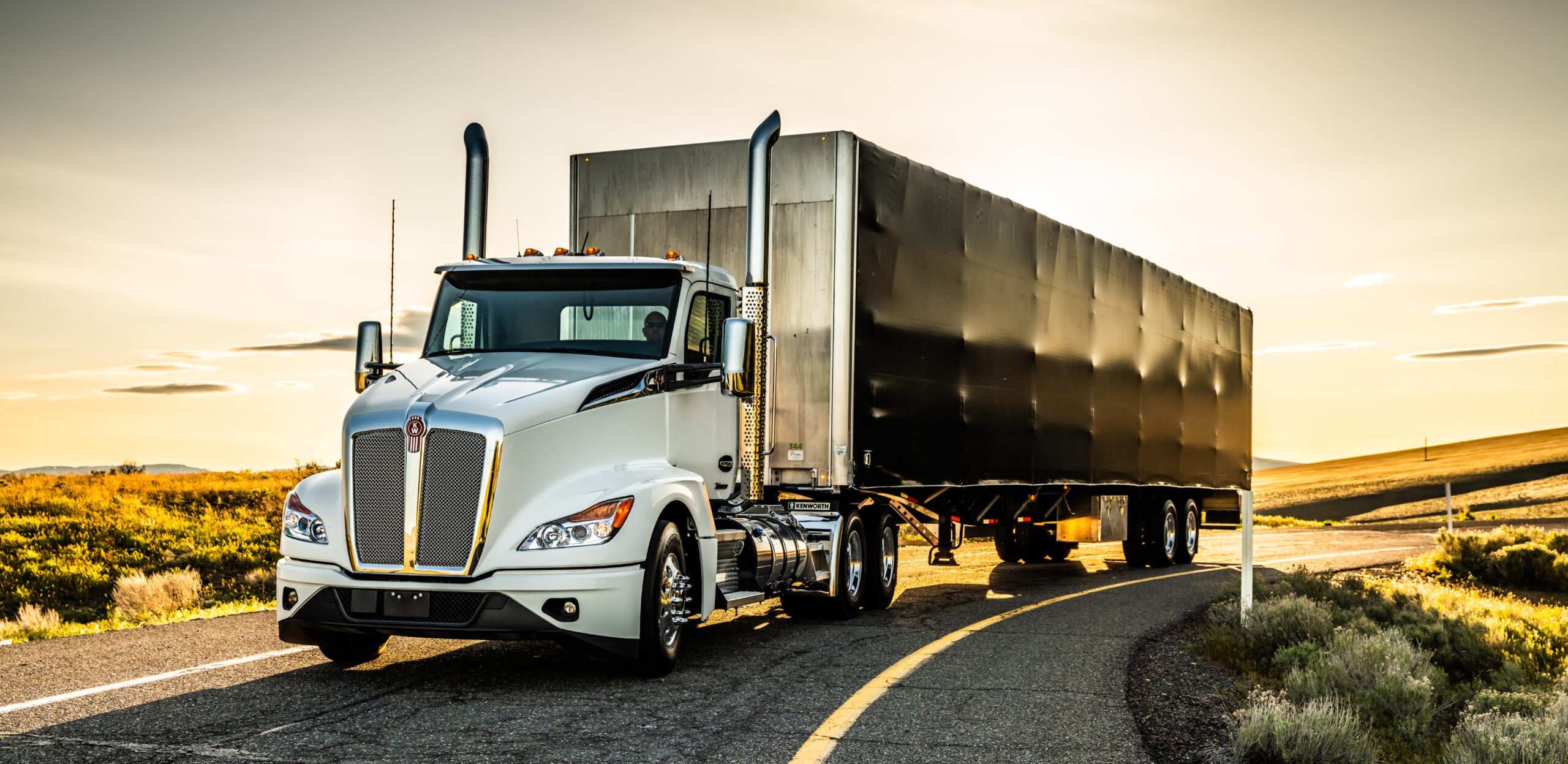 Kenworth heavy-duty truck driving on the highway as fleets prepare for upcoming 2027 EPA emissions regulations