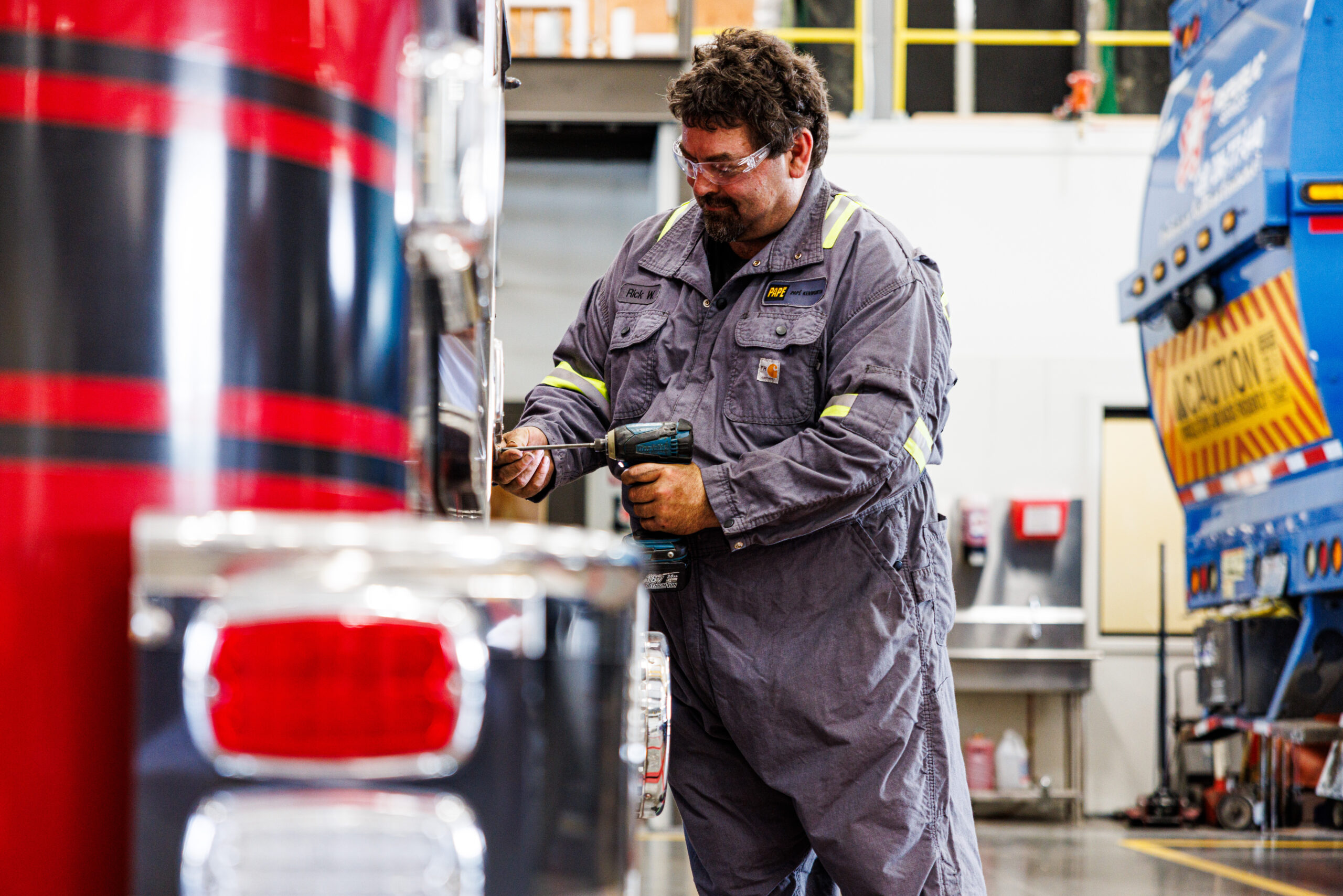 Papé Kenworth technician performing all-makes truck maintenance service to help improve fleet uptime and reliability