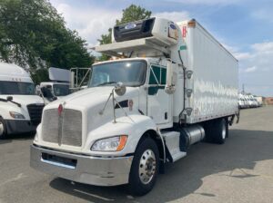 Kenworth T370 refrigerated truck with Kidron insulated body and Carrier refrigeration unit for cold chain transportation.